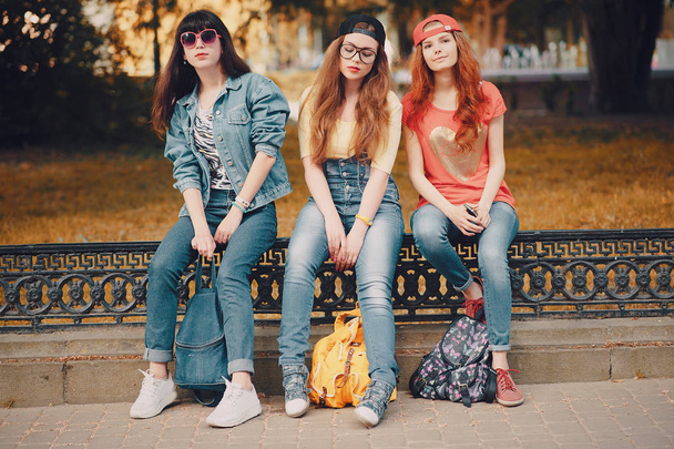three young girls walking in the park - Photo, image