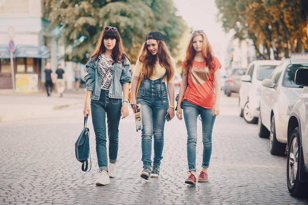 three young girls walking in the park - Fotó, kép