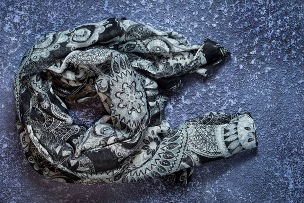 Grey scarf on cement dark background. Top view with copy space - Photo, Image