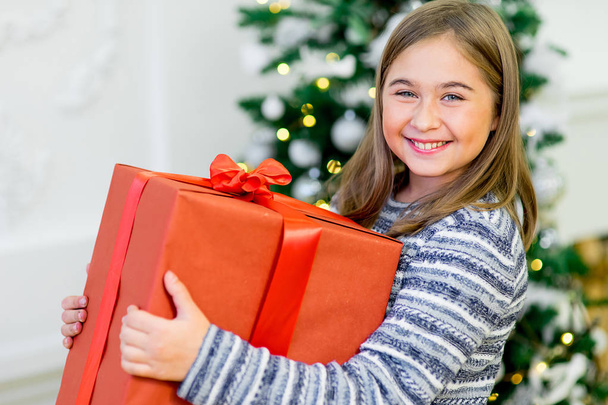 portrait of a girl with a Christmas present - 写真・画像