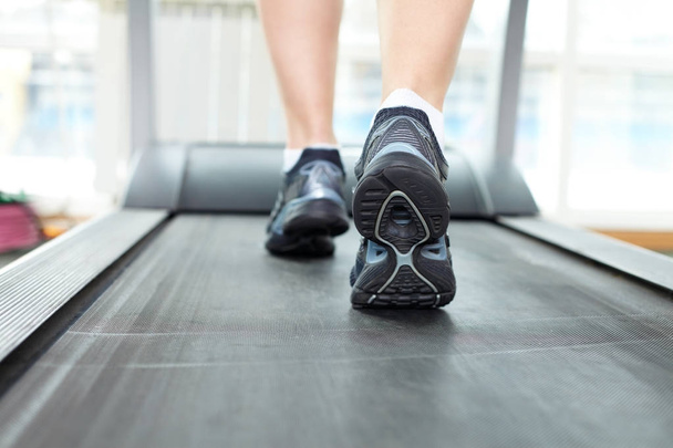 Female legs running on treadmill  - Fotografie, Obrázek