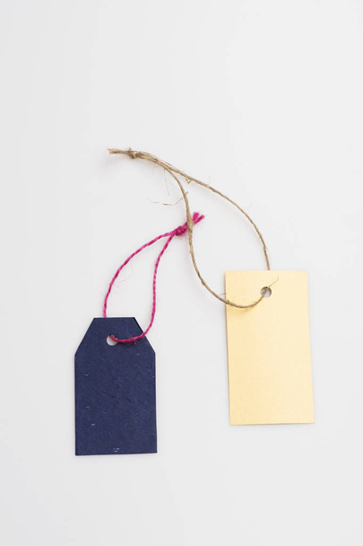 Blue and yellow tag with thread - Photo, image