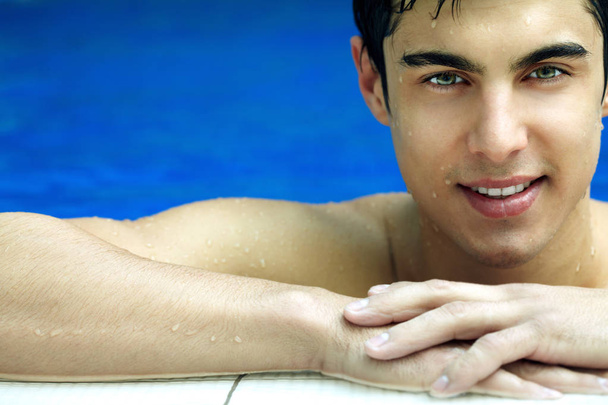 young man spending time in pool  - Photo, Image