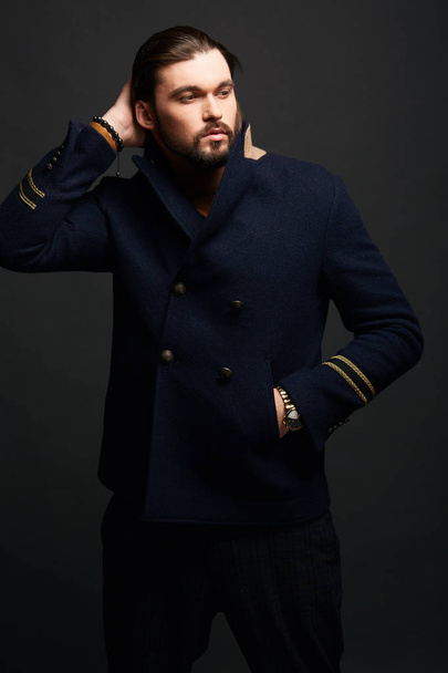 Stylish male model with long hair wearing classic fashionable blue jacket - Фото, изображение