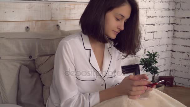 Smiling female use internet on telephone in apartment. - Video, Çekim
