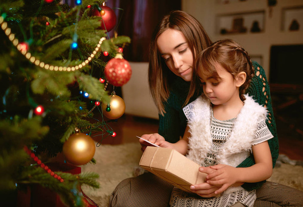 Woman with little daughter on Christmas  - Photo, Image