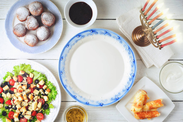 Traditional Hanukkah  dishes on the white wooden table top view - 写真・画像