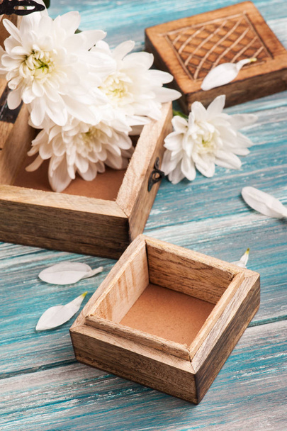rustic wooden box and bouquet of flowers - Photo, Image
