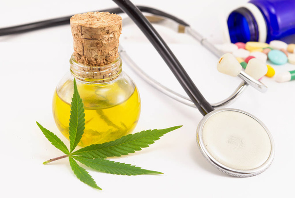 marijuana, cannabis oil, stethoscop and pills - Photo, Image