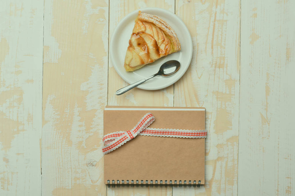 Slice of apple pie on vintage wooden background - Zdjęcie, obraz