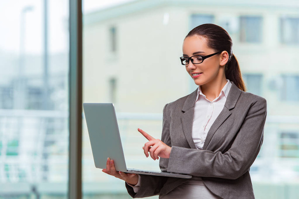 Businesswoman with laptop in business concept - Φωτογραφία, εικόνα
