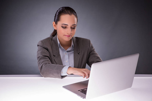 Businesswoman with laptop in business concept - Photo, Image
