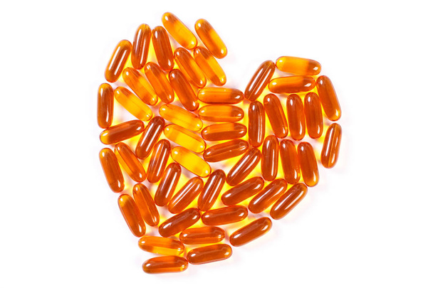 Heart shaped medical pills and capsules on white background, health care concept - Foto, Imagen