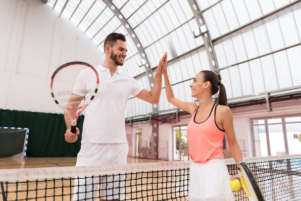 Positive tennis players giving high five - Фото, зображення