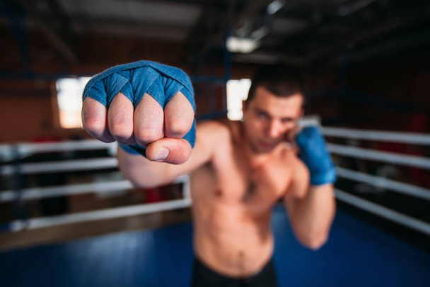 Boxer in blue wrist wraps training  - Fotó, kép