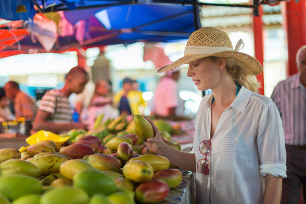 Traveler shopping on traditional Victoria food market, Seychelles. - Photo, Image