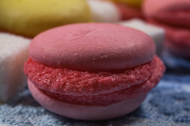 Pink macarons on a plate - Фото, зображення
