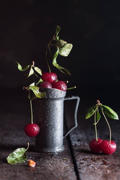 Fresh cherry with drops and leaves - Photo, Image