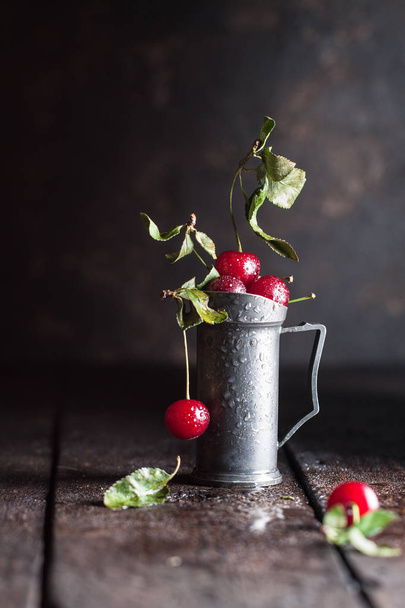Fresh cherry with drops and leaves - Photo, Image
