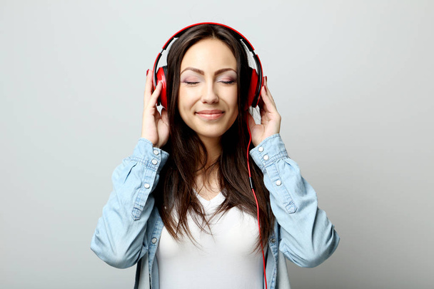 Young beautiful woman listening music  - 写真・画像
