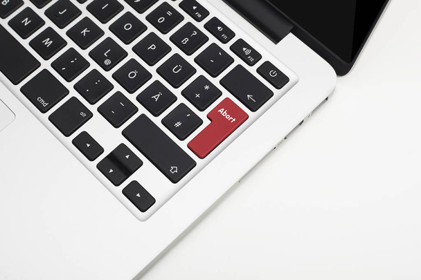 Laptop's keyboard with red Abort key and copyspace - Foto, Imagem