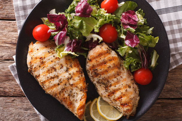 Grilled chicken breast with mixed salad close-up. horizontal top - Photo, Image