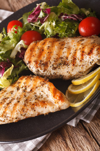 Grilled chicken breast with mixed salad close-up. Vertical - Photo, Image