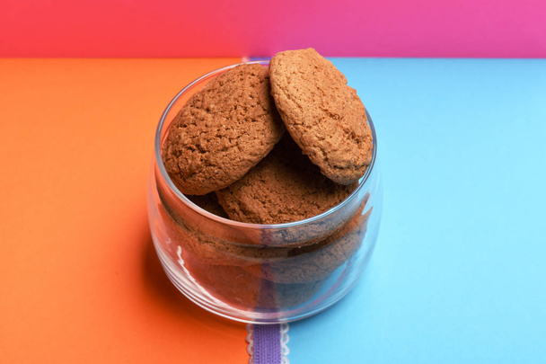 Oatmeal cookies in glass jar - Фото, изображение
