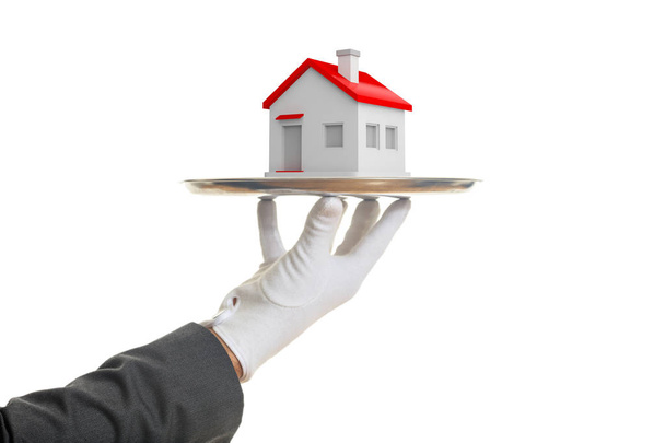 3d rendering waiter offering a house - Photo, Image