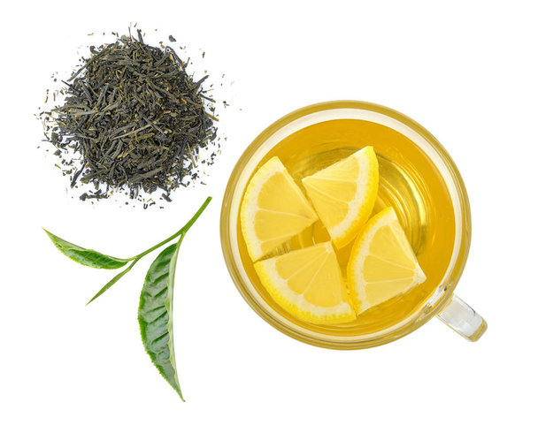 ποτήρι λεμόνι και τσάι φύλλα τσαγιού σε λευκό φόντο - Φωτογραφία, εικόνα