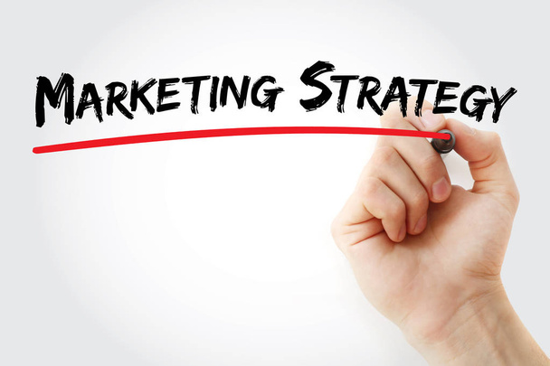 Hand writing marketing strategy with marker - Foto, imagen
