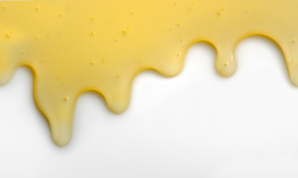Líquido de miel que fluye hacia abajo
  - Foto, imagen