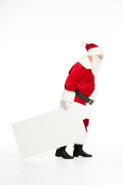 Santa Claus pulling white board - Foto, afbeelding