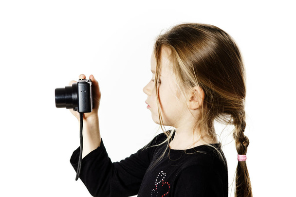 Cute little girl with compact digital camera - Φωτογραφία, εικόνα