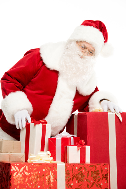 Santa Claus with pile of Christmas gifts - Foto, Imagem