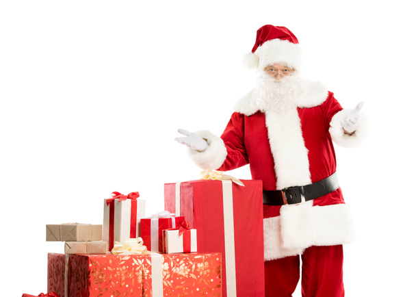 Santa Claus with pile of Christmas gifts - Φωτογραφία, εικόνα