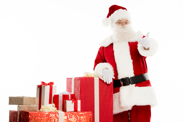Père Noël avec pile de cadeaux de Noël
 - Photo, image