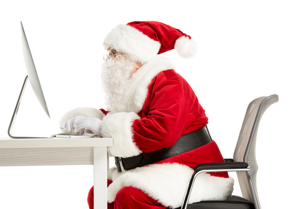 Santa Claus working on computer - Photo, image