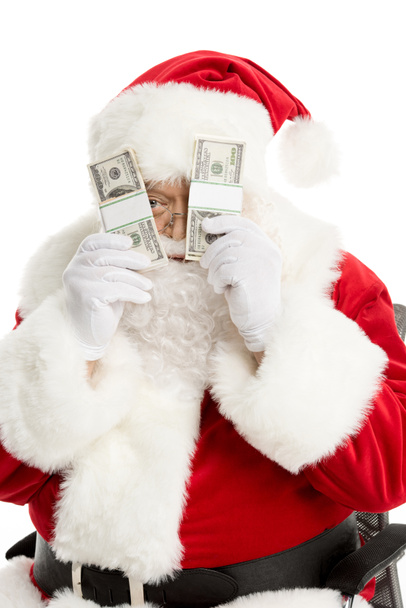 Santa Claus espiando desde billetes de dólar
  - Foto, imagen