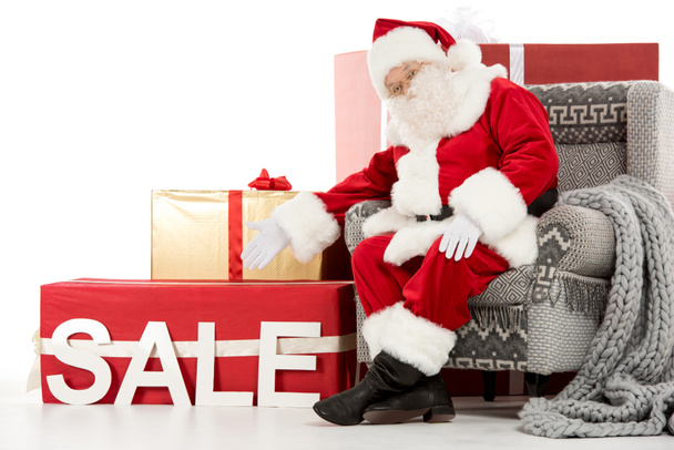 Joulupukki osoittaa myyntiin merkki
 - Valokuva, kuva