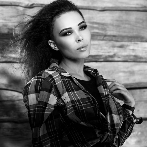 Young sensual & beauty brunette woman pose on wooden background. Black-white photo. - Φωτογραφία, εικόνα