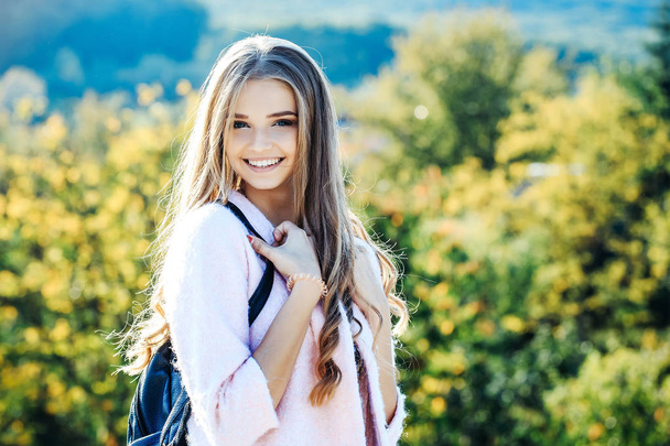Pretty girl smiles outdoors - Fotografie, Obrázek