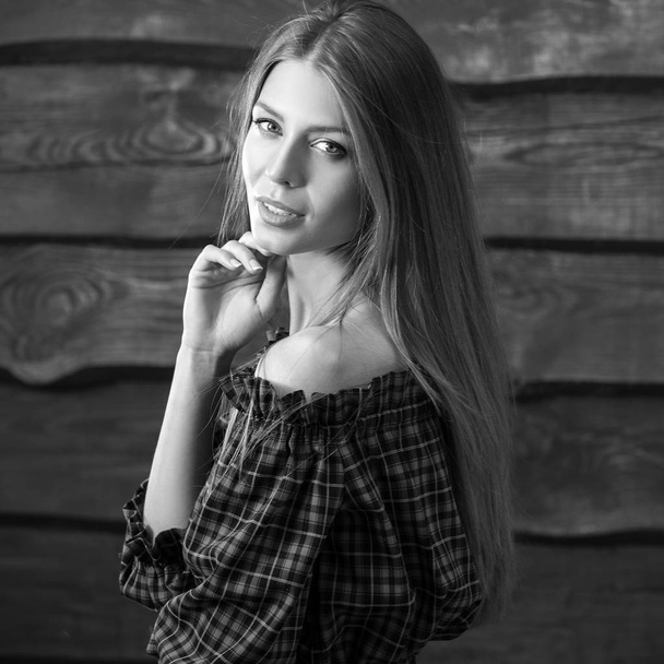 Young sensual & beauty blonde woman pose on wooden background. Black-white photo. - Valokuva, kuva