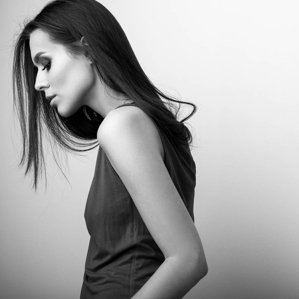 Black-white studio portrait of beautiful young brunette woman. - Fotografie, Obrázek
