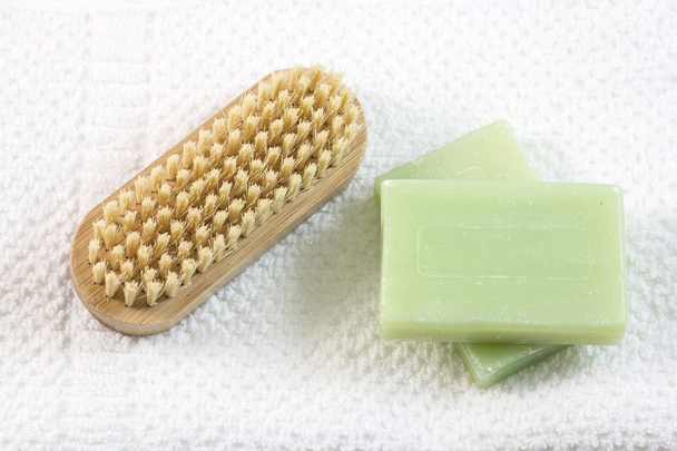 Soap and brush for legs on towel - Photo, Image