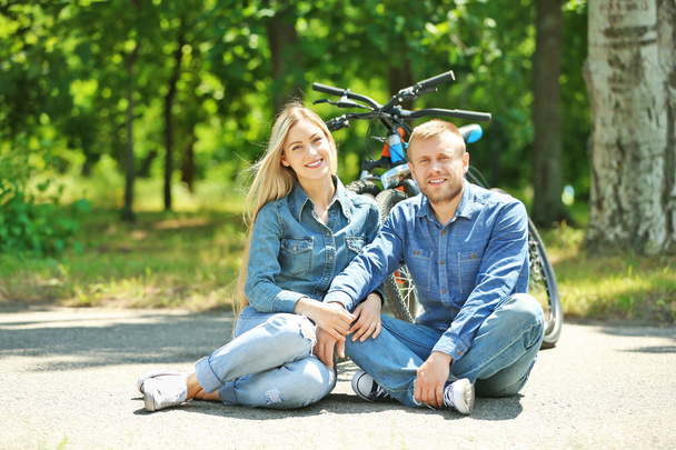Happy couple with bicycles - 写真・画像