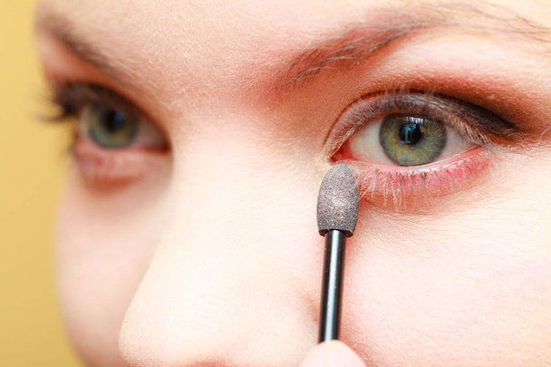 Close up woman getting make up, eyeshadow - Φωτογραφία, εικόνα