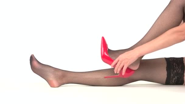 Woman putting on heel shoes. - Footage, Video