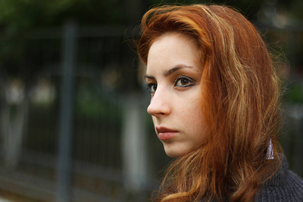 red-haired girl in autumn jacket - Valokuva, kuva