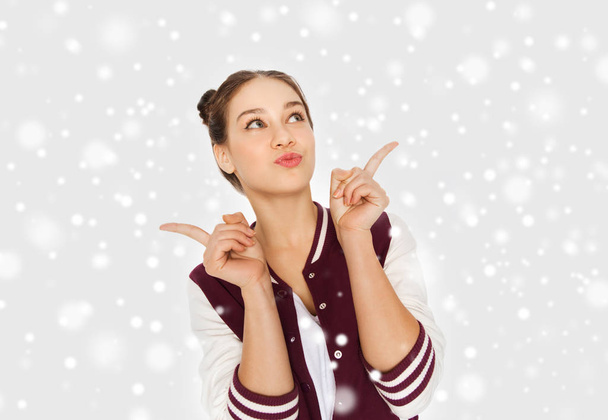 happy pretty teenage girl over snow - Foto, immagini